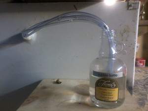 i keep the bubble bottle outside the fermentor with hoses  or else i affixiate if i go inside and colapse