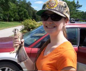 Kristen holding kestrel. Shows the little raptor very clearly.