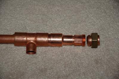 Head end with compression fitting.