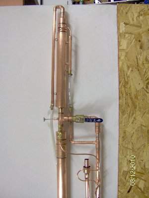 Condenser is 16&quot; length of 2&quot; shell with a 16&quot;long 1 1/2&quot; cold finger. <br />The cold finger is wrapped with 1/4&quot; o.d. tubing which is coiled around the cold finger. <br />A 1/4&quot; space between the windings of the coil forces Vapor to spiral up toward vent &lt; no vapor escapes