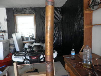this is kinda what its going to look like except the take off vaule(going to be in the same cap im tryig to solder) , the thermoter(going to be at the top of the column but below the first <br />cap) then the top pipe is where my condenser is going to go.