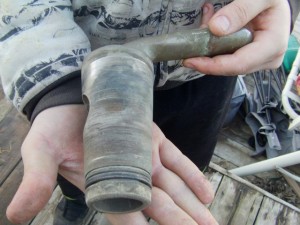This is the drain for the boiler, it was leaking. It is just held in by gravity and a pin, and sealed with an O ring. The O ring is quite worn. The &quot;Gate&quot; is scored as well.