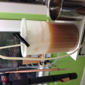 Siphoning off a batch of Birdwatchers sugar wash